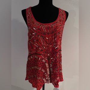 Razor back top with gold shingle type all over shirt.